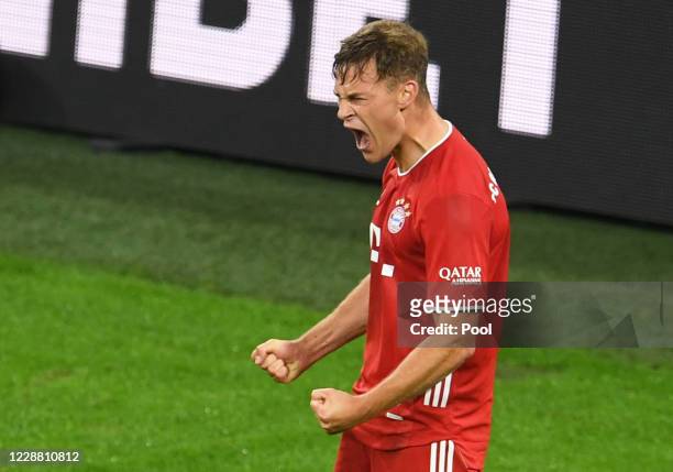 Bayern Munich's Joshua Kimmich celebrates scoring their third goal during the Supercup 2020 match between FC Bayern München and Borussia Dortmund at...