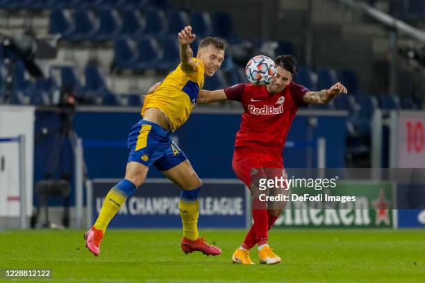 Eden Karzev of Maccabi Tel-Aviv FC and Dominik Szoboszlai of Red Bull Salzburg battle for the ball during the UEFA Champions League Play-Off second...