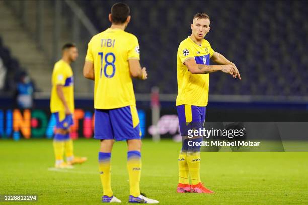 Eden Karzev of Tel Aviv discusses with Eytan Tibi of Tel Aviv during the UEFA Champions League Play-Off second leg match between RB Salzburg and...