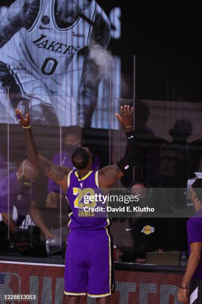 Playoffs: Rear view of Los Angeles Lakers LeBron James tossing talc powder in air before game vs Denver Nuggets at AdventHealth Arena. Orlando, FL...