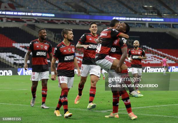 Brazil's Flamengo forward Lincoln celebrates with teammates his goal during their closed-door Copa Libertadores group phase football match against...