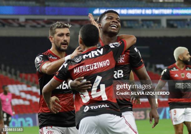 Brazil's Flamengo forward Lincoln celebrates with teammates his goal during their closed-door Copa Libertadores group phase football match against...