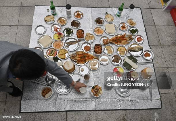 North Korean refugee Han Hong-geun performs a ceremonial offering to relatives and ancestors from North Korea, at Imjingak peace park near the...