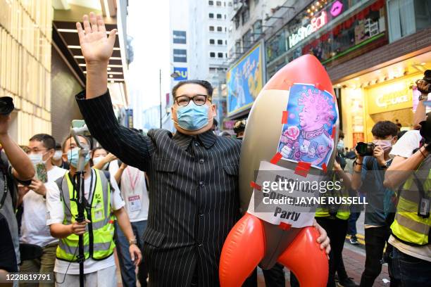 North Korean leader Kim Jong Un impersonator Howard X joins a protest in the Causeway Bay districk during China's National Day in Hong Kong on...