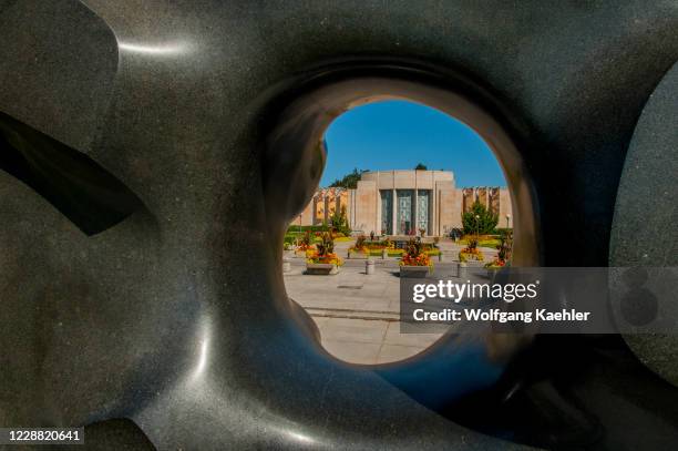 View of the Asian Art Museum through the Black Sun sculpture by Isamu Noguchi at Volunteer Park on Capitol Hill in Seattle, Washington State, USA.