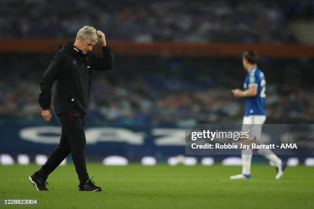 Dejected Alan Irvine the assistant head coach / manager of West Ham United who is filling in for David Moyes the head coach / manager of West Ham...