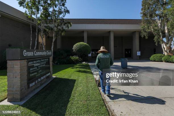 Grounds keeper trips the grass at Grace Community Church on Friday, Sept. 4, 2020 in Sun Valley, CA.