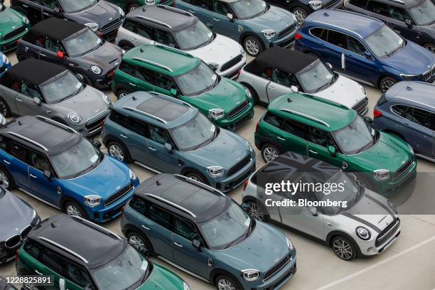 New Mini automobiles, manufactured by Bayerische Motoren Werke AG , included one with a Union Flag, also known as a Union Jacks on its roof, sit...