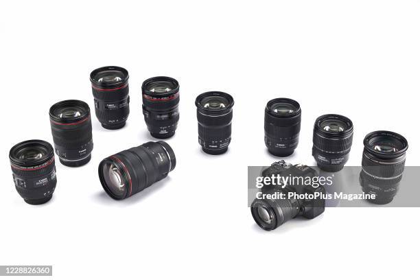 Canon EOS 200D DSLR camera and a group of Canon standard zoom lenses, taken on December 13, 2019.