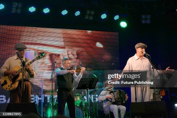 Musicians are seen on stage during a joint concert of singer Valentyn Kuba and the Mamyni Dity klezmer band to present the Everything Will Be Fine!...