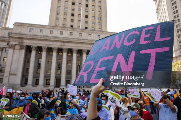 Demonstrator holds a sign reading "Cancel Rent" during an eviction protest in Foley Square in New York, U.S., on Thursday, Oct. 1, 2020. Housing...