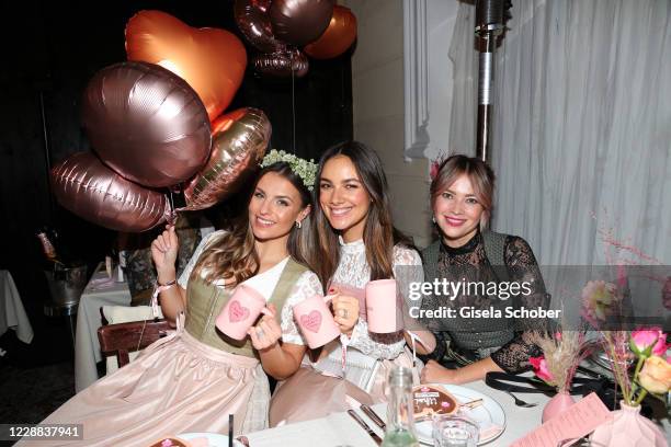 Laura Wontorra, Janina Uhse and Laura Osswald attend the Madlwiesn 2020 at Restaurant Borchardt on October 1, 2020 in Berlin, Germany.