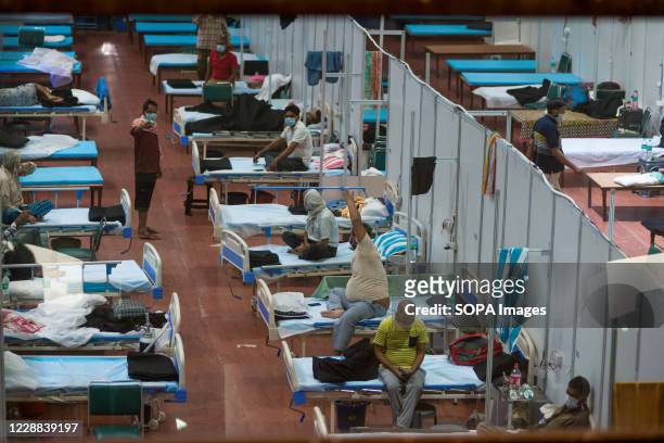 Covid-19 infected patients inside an isolation ward at Common Wealth Games village which is turned into temporary COVID 19 care center. India Health...