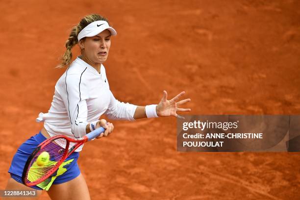 Canada's Eugenie Bouchard returns the ball to Poland's Iga Swiatek during their women's singles third round tennis match on Day 6 of The Roland...