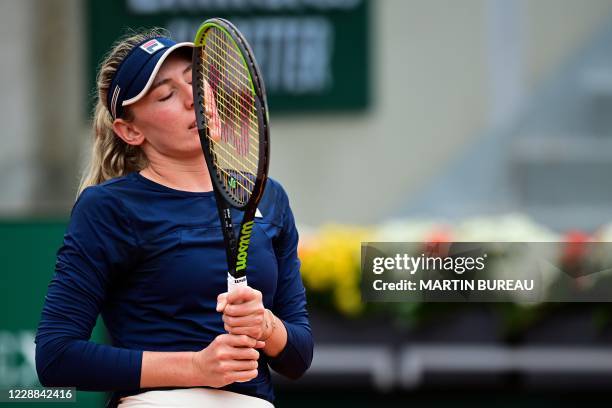 Russia's Ekaterina Alexandrova reacts as she plays against Ukraine's Elina Svitolina during their women's singles third round tennis match on Day 6...