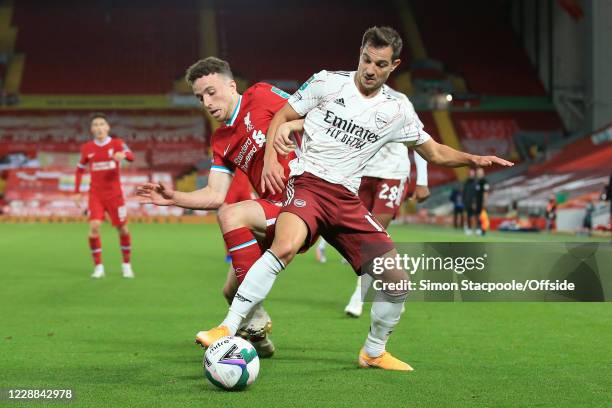 Diogo Jota of Liverpool battles with Cedric Soares of Arsenal during the Carabao Cup Fourth Round match between Liverpool and Arsenal at Anfield on...