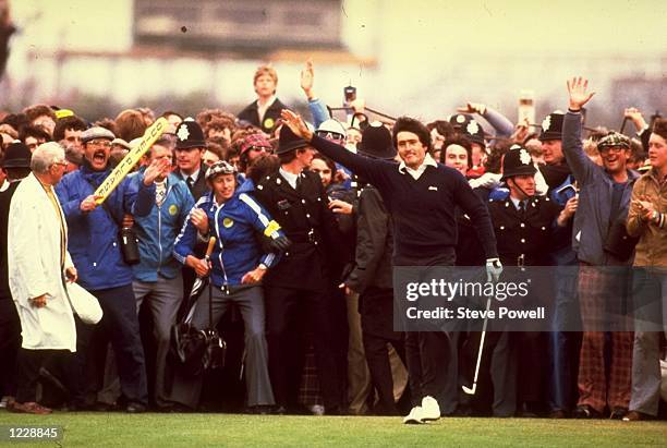 Seve Ballesteros of Spain acknowledges the crowd after holing his putt on the 18th green to win the British Open at the Royal Lytham Golf Club in...