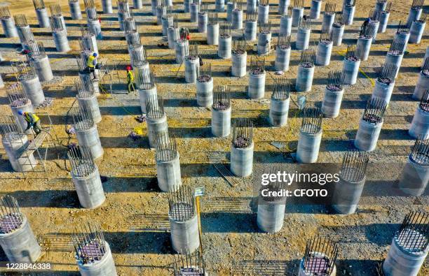 Zhangye to Sunan first level road site workers are finishing cement foundation piles. Zhangye City, Gansu Province, China, October 2, 2020-