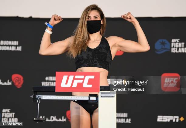 In this handout image provided by UFC, Irene Aldana of Mexico poses on the scale during the UFC Fight Night weigh-in on October 02, 2020 in Abu...