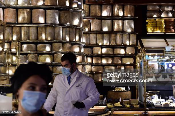 Waiter stands at the cheese corner of the "Les Grands Buffets" restaurant on October 2, 2020 in Narbonne, a day after its re-opening following a six...