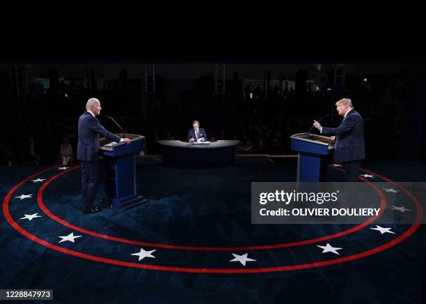 President Donald Trump and Democratic presidential candidate Joe Biden participate in the first presidential debate at the Health Education Campus of...