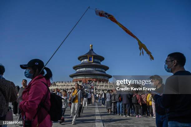 People visit the Temple of Heaven on October 2, 2020 during the national holiday in Beijing, China. China is celebrating its national day marking the...