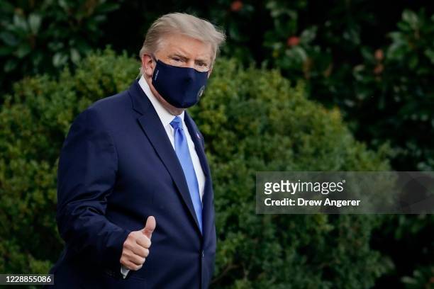 President Donald Trump leaves the White House for Walter Reed National Military Medical Center on the South Lawn of the White House on October 2,...