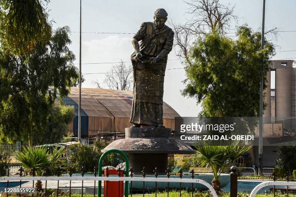 This picture taken on August 29, 2020 shows the statue of al-Sawas, which in english means The Licorice Man and depicts a street peddler selling...