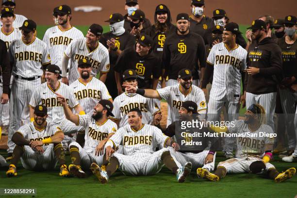 The San Diego Padres celebrate after defeating the St Louis Cardinals during Game Three of the National League Wildcard series at PETCO Park on...