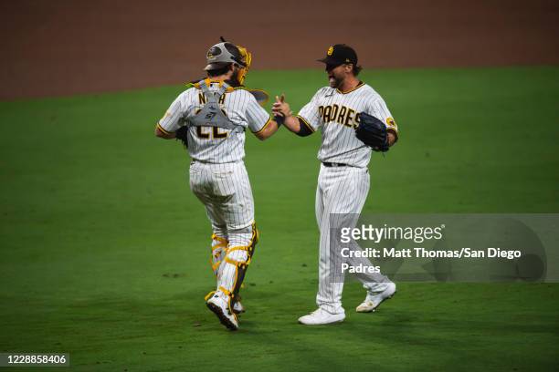 Trevor Rosenthal and Austin Nola of the San Diego Padres celebrate after defeating the St Louis Cardinals during Game Three of the National League...