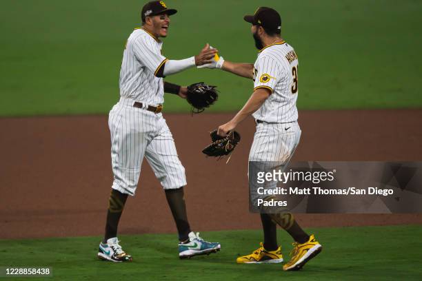Manny Machado and Eric Hosmer of the San Diego Padres celebrate after defeating the St Louis Cardinals during Game Three of the National League...