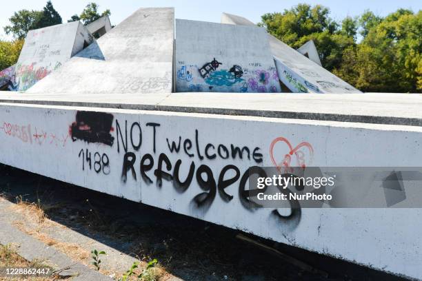 Welcome Refugees' a wall graffiti seen on Memorial Complex Hillock of Fraternity, located in 'Relaxation and Culture' Park, in Plovdiv. On October...