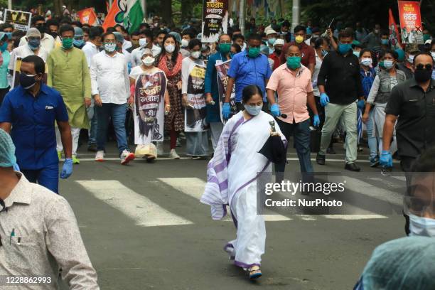 Chief Minister of West Bengal and Supremo of Trinamool Congress political party Mamata Banerjee ,center in white sari, leads a rally a mass rally...