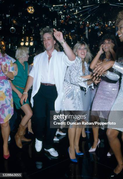 British glamour models including Samantha Fox and Linda Lusardi dancing at the Sun newspaper "Page 3 Girl of the Year" event which was presented by...