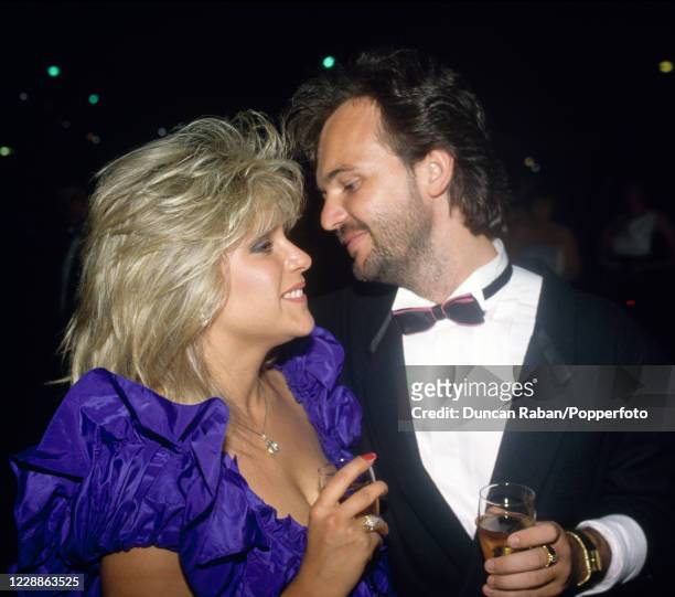 British glamour model and singer Samantha Fox with her boyfriend Peter Foster attending The Berkeley Square Ball in London, England on 6 July, 1987.