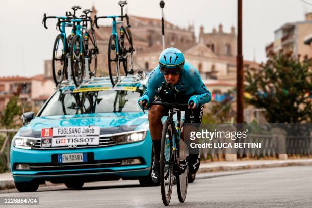Team Astana rider Denmark's Jakob Diemer Fuglsang rides past the Santa Maria Nuova cathedral of Monreale during the first stage of the Giro d'Italia...