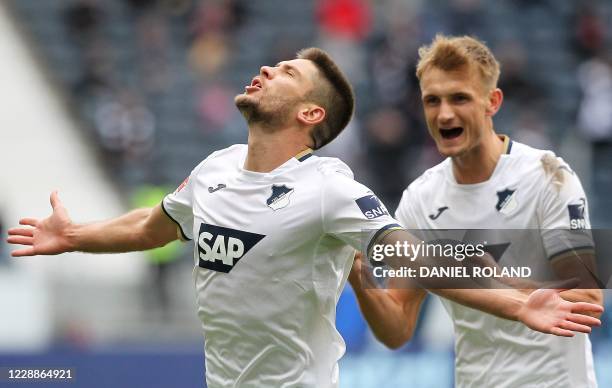 Hoffenheim's Croatian forward Andrej Kramaric celebrates after scoring a goal with Hoffenheim's Austrian defender Stefan Posch during the German...
