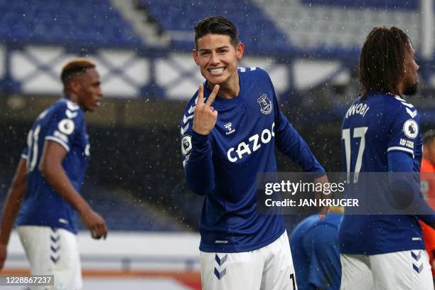 Everton's Colombian midfielder James Rodriguez celebrates scoring his second goal, their fourth during the English Premier League football match...