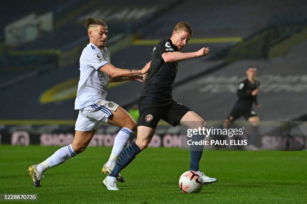 Leeds United's English midfielder Kalvin Phillips vies for the ball against Manchester City's Belgian midfielder Kevin De Bruyne during the English...