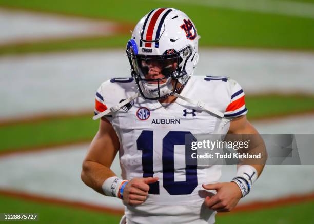 Bo Nix of the Auburn Tigers leaves the field at halftime of a game against the Georgia Bulldogs at Sanford Stadium on October 3, 2020 in Athens,...