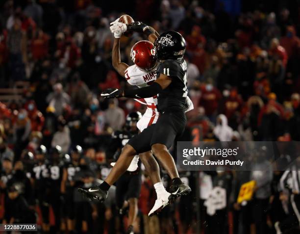 Defensive back Lawrence White IV of the Iowa State Cyclones breaks ups a pass meant for wide receiver Marvin Mims of the Oklahoma Sooners in the...
