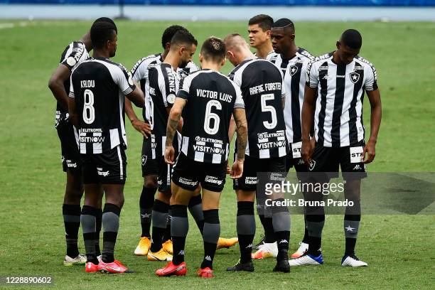 Players of Botafogo gather in the middle of the field during the match between Botafogo and Fluminense as part of the Brasileirao Series A at...