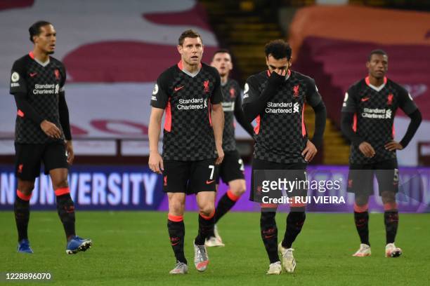 Liverpool's Egyptian midfielder Mohamed Salah and teammates react to going 7-2 down during the English Premier League football match between Aston...