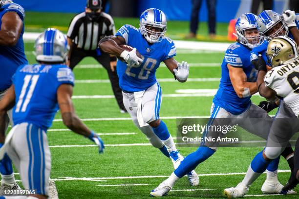 Adrian Peterson of the Detroit Lions runs the ball during the fourth quarter against the New Orleans Saints at Ford Field on October 4, 2020 in...