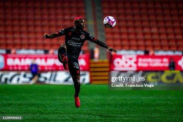 Fabian Castillo of Tijuana jumps for the ball during the 13th round match between Tijuana and Chivas as part of the Torneo Guard1anes 2020 Liga MX at...