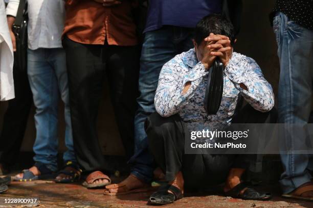 Stranded Bangladeshi migrant workers who work in Saudi Arabia wait for air tickets to return back their work places, in Dhaka, Bangladesh on October...