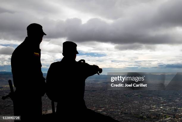 security personnel looking down on bogota, colombia - colombian military stock pictures, royalty-free photos & images