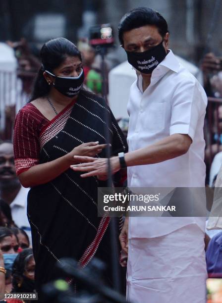 Kanimozhi Member of Parliament and Dravida Munnetra Kazhagam women's wing chief and party President M.K. Stalin attend a protest march to condemn the...