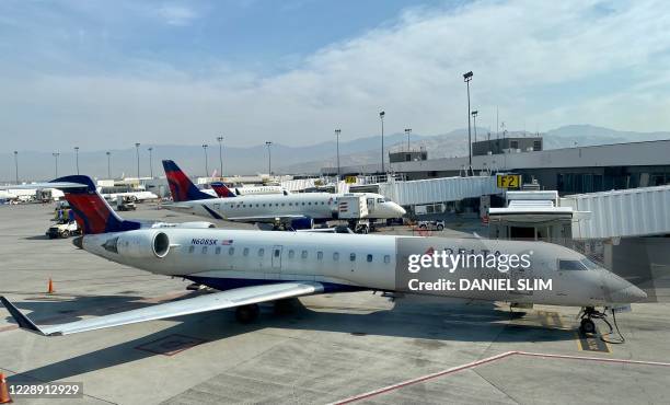 Delta Airlines plane is seen at the gate at Salt Lake City International Airport , Utah, on October 5, 2020.