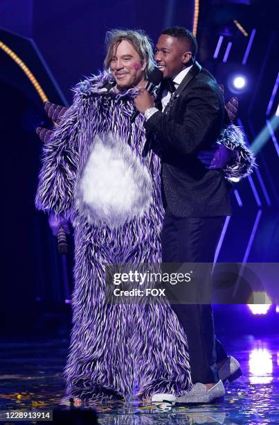 Mickey Rourke and host Nick Cannon in the "Six More Masks" episode of THE MASKED SINGER airing Wednesday, Sept. 30 on FOX.